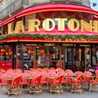 the red chairs and red marquee of La Rotonde.jpg